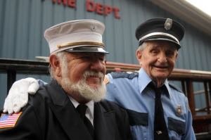 In memoriam. Pictured during the 100th Anniversary of the NBVFD are 1st Assistant Chief Phil Banuet, left, and firefighter Tom Keminski.